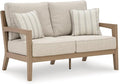 Signature Design by Ashley Hallow Creek Cottage Nuvella Weather Resistant Fabric Outdoor Loveseat with Cushion and 2 Throw Pillows, Light Brown & Beige