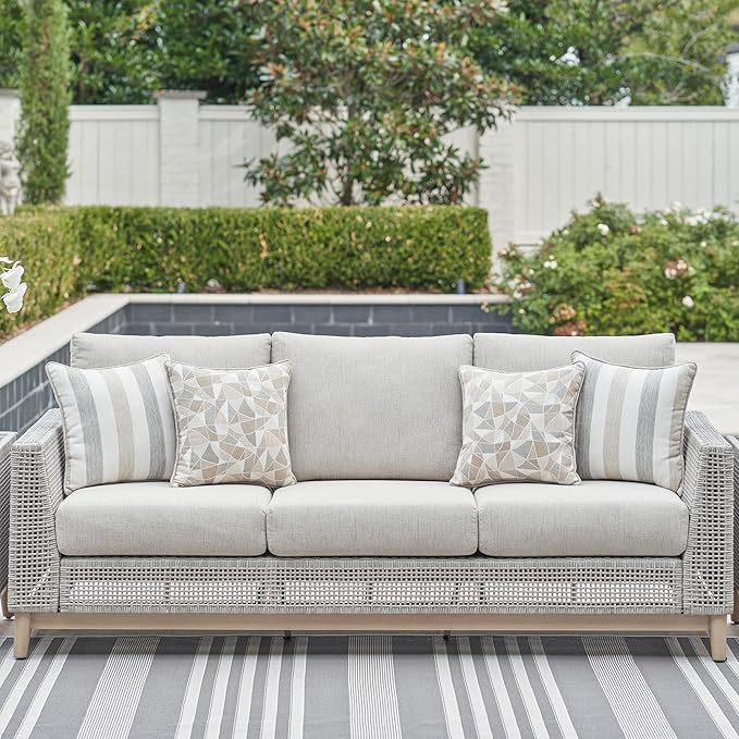 Signature Design by Ashley Seton Creek Cottage Nuvella Weather Resistant Fabric Outdoor Sofa with Cushion and 4 Throw Pillows, Light Brown & Light Gray