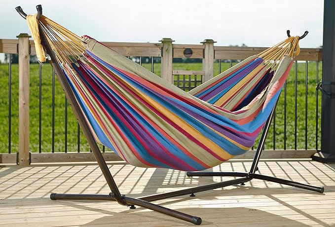 Vivere Double Cotton Hammock with Space Saving Steel Stand, Upgraded Polyester End Strings 450 lb Capacity - Premium Carry Bag Included - (Tropical)